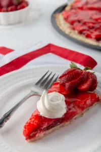 a slice of strawberry pizza on a dessert plate