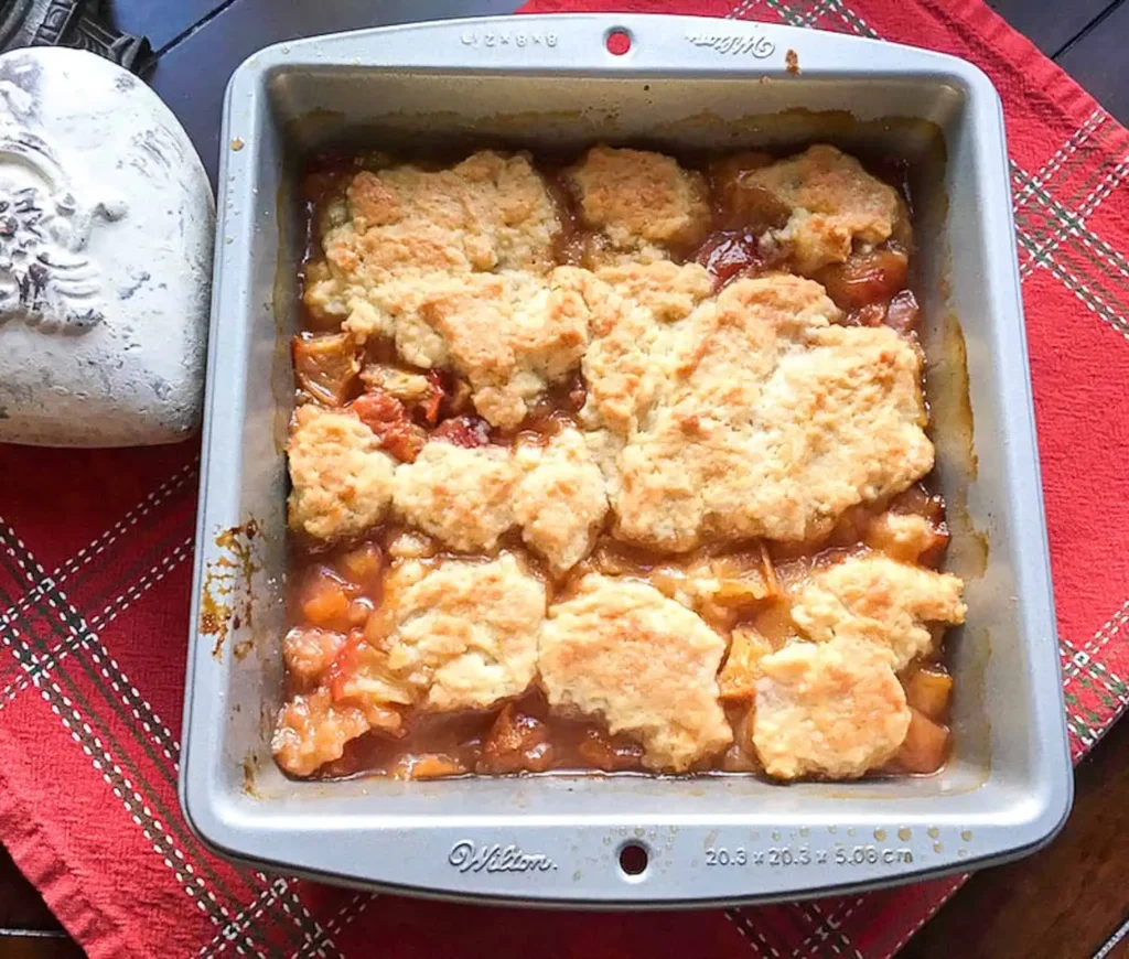 A baking tray with yummy Peach Cobbler.