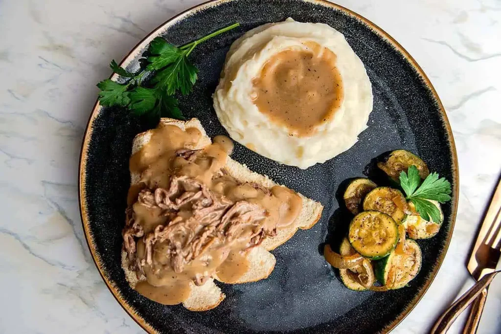 open faced tri tip sandwich with mashed potatoes and gravy that's fix perfecly