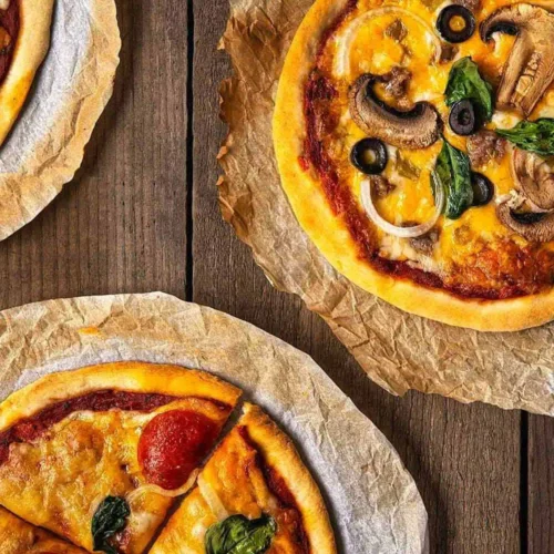 No-Fail, No-Yeast Pizza Dough & Sauce. In this image you'll see three delicious baked pizzas.