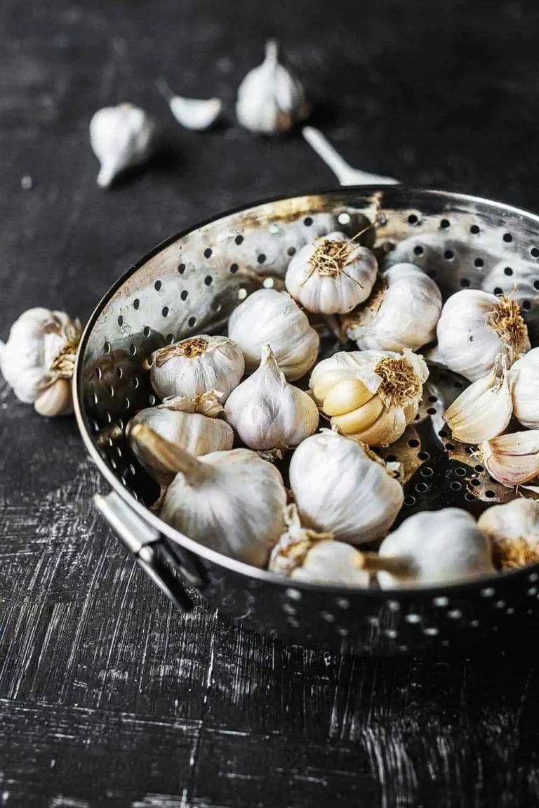 A colander full of Garlic. Let's chat about lovely delicious Garlic.