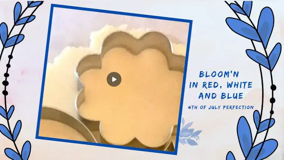 Placeholder image for a sugar cookie decorating video featuring a flower-shaped cookie cutter in dough with the text “Bloom’n in Red, White and Blue – 4th of July Perfection.”