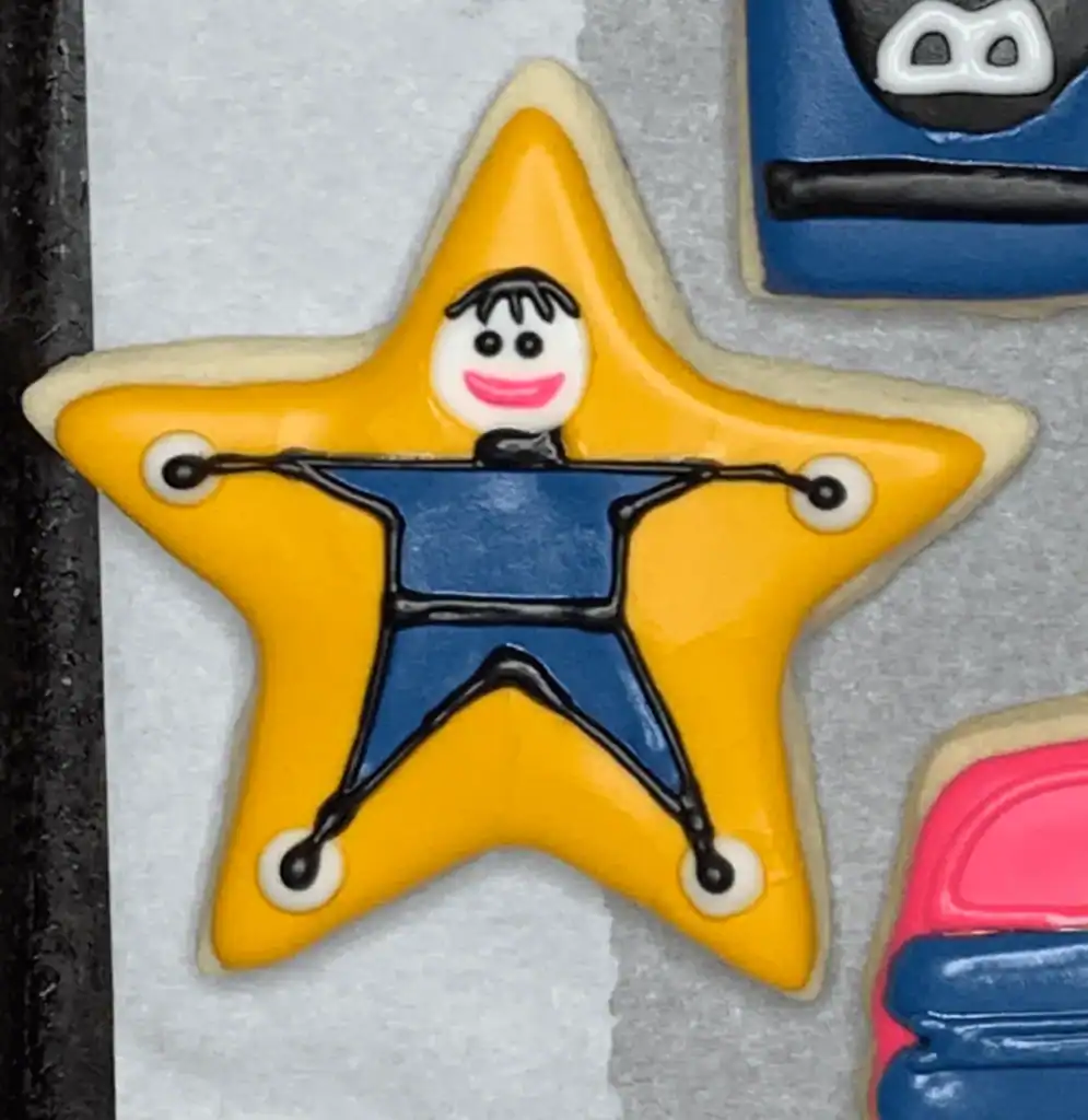Star shaped sugar cookie with a school boy decoration