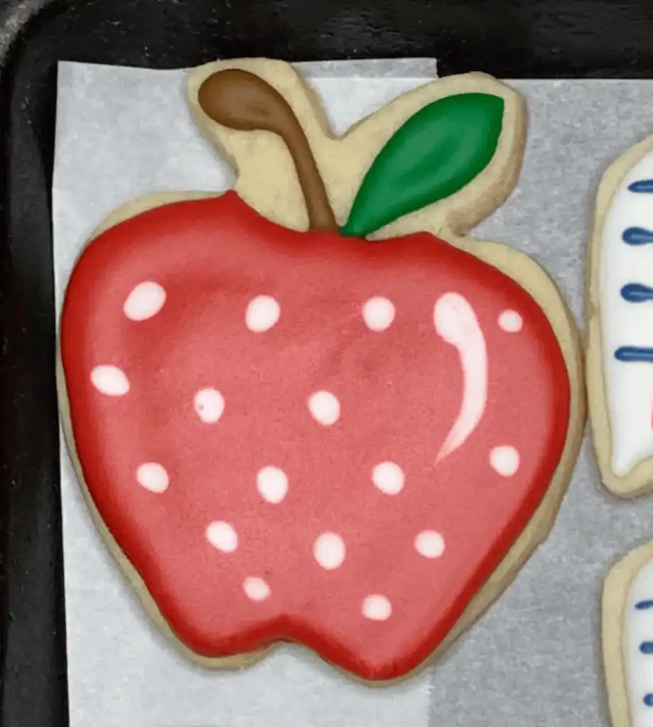polka-dot apple sugar cookie decorated with royal icing