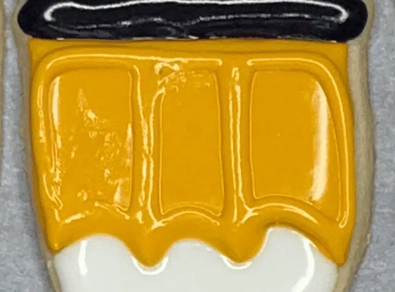 detailed up-close of yellow pencil sugar cookie