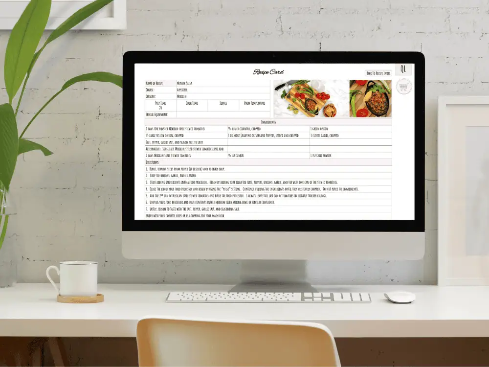 This is a mockup of the SDS Cookbook. There is a desk and atop that sits a desktop computer and on the screen is a recipe from the cookbook