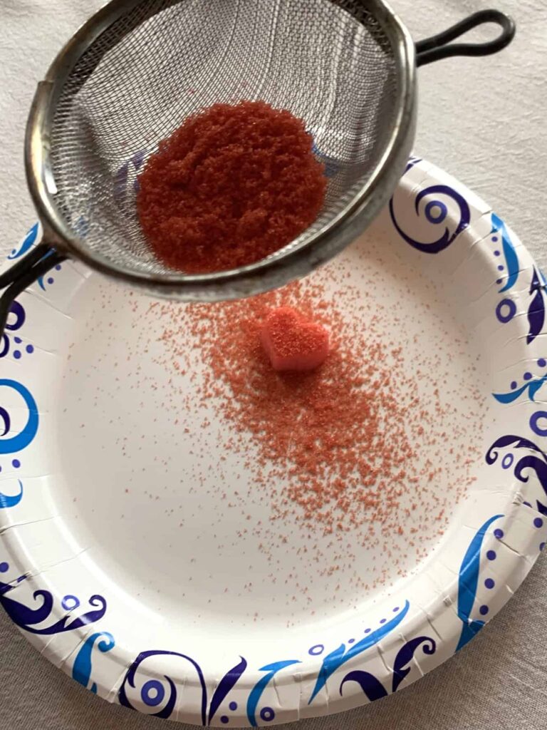 Dusting heart bites with sanding sugar
