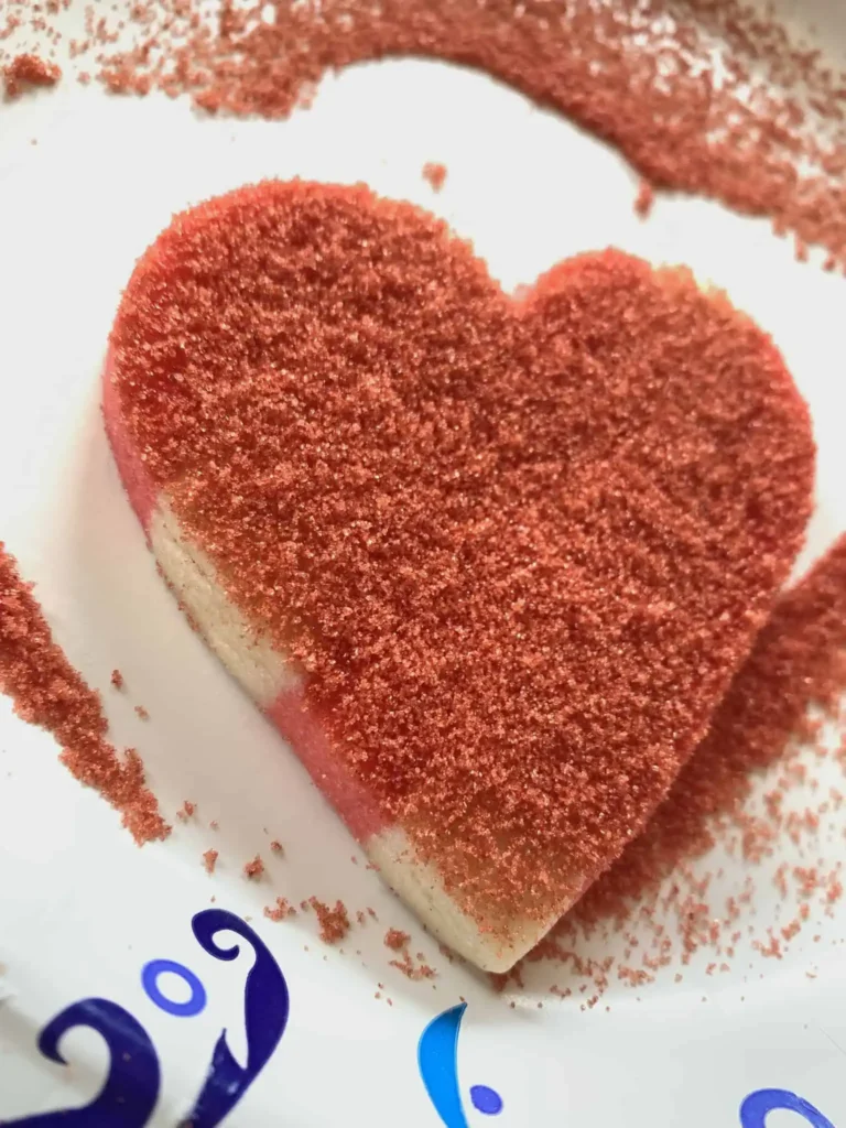 Heart shaped sugar cookie with sanding sugar applied