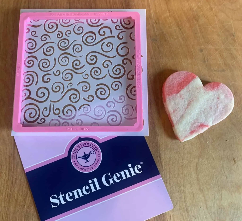 Stencil Genie stenciling tool, stencil and heart shaped sugar cookie.