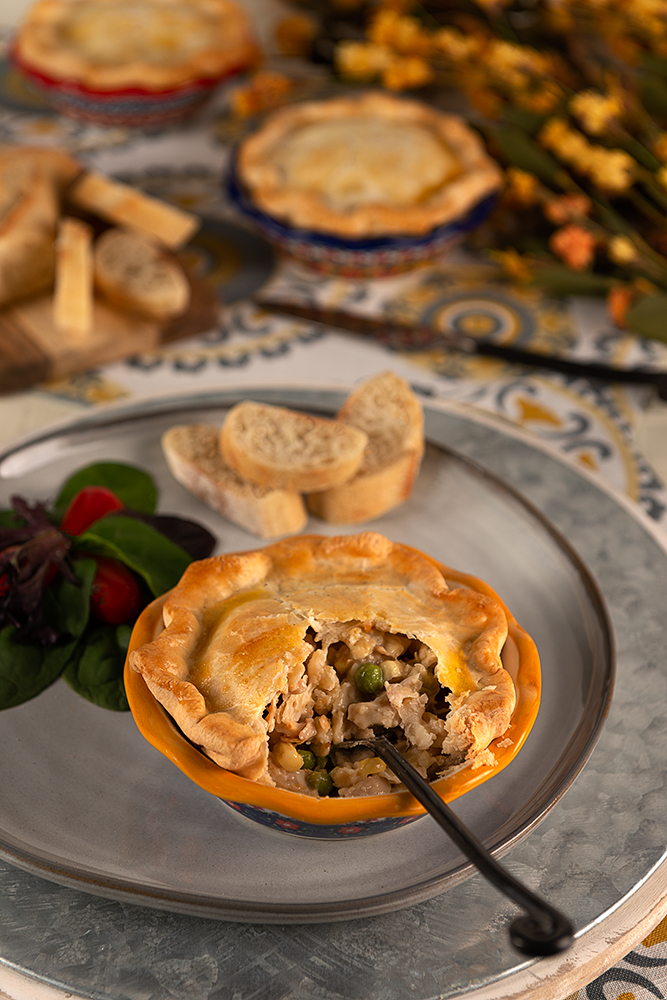Classic Chicken Pot Pie - Up close image of a small single serving chicken pot pie.